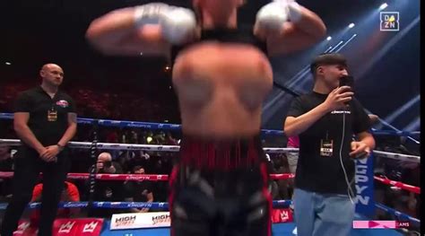 female boxer flashes crowd after win